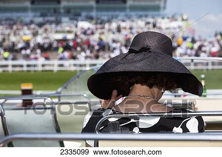 Woman Wearing Fancy Hat At Epsom Derby; London, England, Uk View Large Photo Image Stock Photo - Woman Wearing Fancy Hat At Epsom Derby; London, England, Uk. Fotosearch
