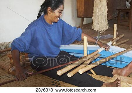 Woman weaving silk at the Fabrique de Papier Antaimoro, Ambalavao, Fianarantsoa Province, Madagascar View Large Photo Image Stock Photo - Woman weaving silk at the Fabrique de Papier Antaimoro, Ambalavao, Fianarantsoa Province, Madagascar. Fotosearch