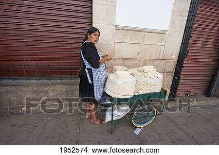 Picture - Woman with a cart loaded with pasankalla, Sucre, Chuquisaca Department, Bolivia. Fotosearch