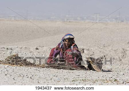 Stock Photo - Woman With Brushwood In The Outskirts Of Kabul,, Afghanistan. Fotosearch
