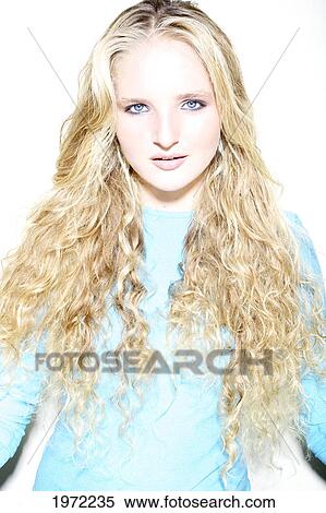 Stock Photography - Woman With Curly Long Blonde Hair Models In Studio.. Fotosearch