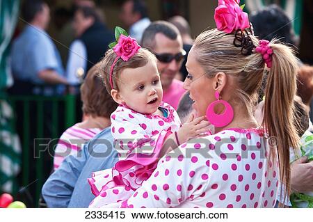 Woman With Daughter In Traditional Seville Clothing At April Fearia Festival; Seville, Andalucia, Spain, Europe View Large Photo Image Stock Photography - Woman With Daughter In Traditional Seville Clothing At April Fearia Festival; Seville, Andalucia, Spain, Europe. Fotosearch
