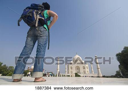 Woman With Rucksack In Front Of The Taj Mahal, Low Angle View View Large Photo Image Picture - Woman With Rucksack In Front Of The Taj Mahal, Low Angle View. Fotosearch