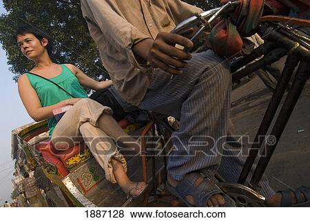 Stock Photo - Woman With Rucksack On Cycle Rickshaw. Fotosearch