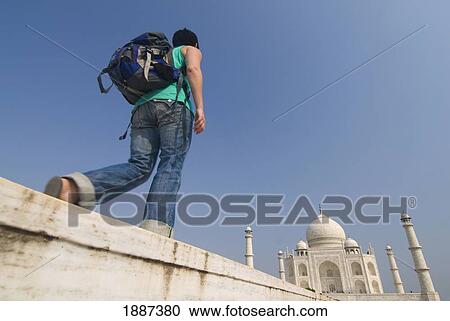 Woman With Rucksack Walking Towards The Taj Mahal, Low Angle View View Large Photo Image Stock Image - Woman With Rucksack Walking Towards The Taj Mahal, Low Angle View. Fotosearch