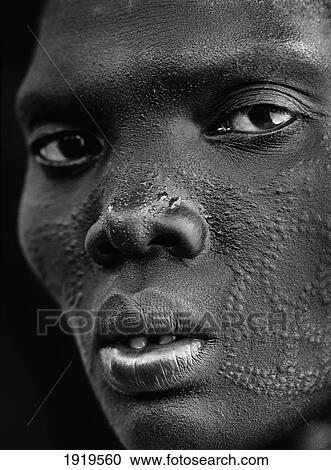 Stock Image - Woman With Scarified Face,; Lankien Village, Sudan. Fotosearch