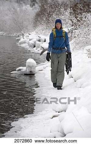 Woman With Snowshoes In Winter, Kathleen Lake, Kluane National Park, Yukon, Canada View Large Photo Image Stock Image - Woman With Snowshoes In Winter, Kathleen Lake, Kluane National Park, Yukon, Canada. Fotosearch