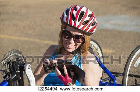 Woman with spinal cord injury cycling using hand propelled bicycle; Edmonton, Alberta, Canada View Large Photo Image Picture - Woman with spinal cord injury cycling using hand propelled bicycle; Edmonton, Alberta, Canada. Fotosearch