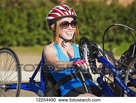 Woman with spinal cord injury cycling using hand propelled bicycle; Edmonton, Alberta, Canada View Large Photo Image Stock Image - Woman with spinal cord injury cycling using hand propelled bicycle; Edmonton, Alberta, Canada. Fotosearch