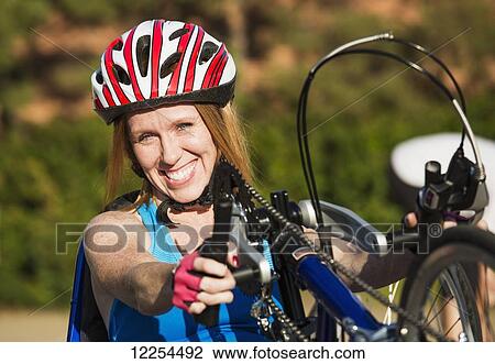 Woman with spinal cord injury cycling using hand propelled bicycle; Edmonton, Alberta, Canada View Large Photo Image Stock Image - Woman with spinal cord injury cycling using hand propelled bicycle; Edmonton, Alberta, Canada. Fotosearch