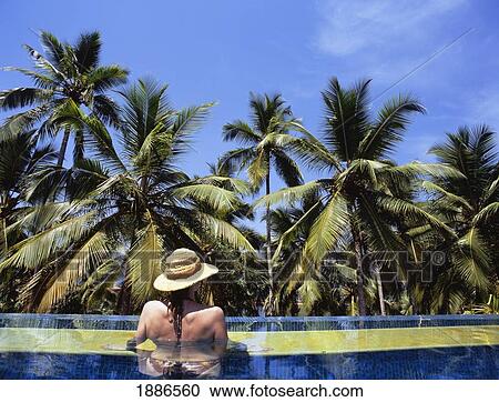 Woman With Straw Hat Relaxing In Swimming Pool View Large Photo Image Stock Image - Woman With Straw Hat Relaxing In Swimming Pool. Fotosearch
