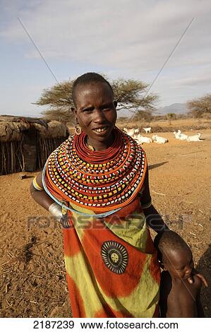 Woman with young child, wearing colourful beaded necklace, Sumburu Manyatta village; Samburu, Kenya View Large Photo Image Stock Photo - Woman with young child, wearing colourful beaded necklace, Sumburu Manyatta village; Samburu, Kenya. Fotosearch