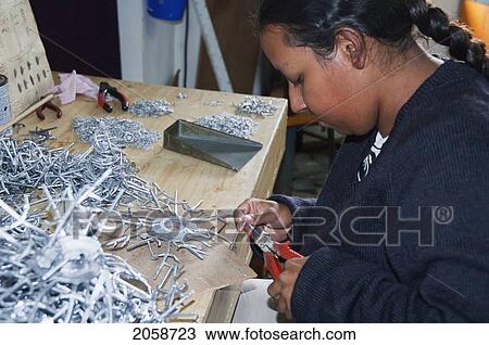 Woman Working On Metal Pieces For Ship Models At The Bobato Ltee Factory, Curepipe, Mauritius View Large Photo Image Stock Image - Woman Working On Metal Pieces For Ship Models At The Bobato Ltee Factory, Curepipe, Mauritius. Fotosearch