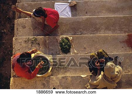 Stock Photo - Woman Working On Stairs, Aerial View. Fotosearch