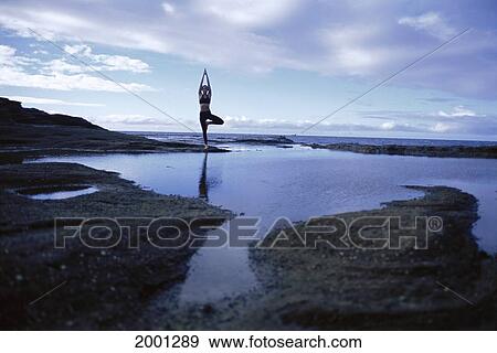 Woman Yoga On Rocks At Sunrise Pool With Reflection Foreground Ocean Background View Large Photo Image Stock Photo - Woman Yoga On Rocks At Sunrise Pool With Reflection Foreground Ocean Background. Fotosearch