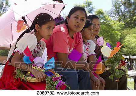 Stock Image - Women And Girls Watching The Entrada De Comadritas Parade During The Carnaval Chapaco, Tarija, Bolivia. Fotosearch