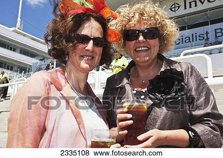Stock Photo - Women At Epsom Derby On Lady's Day; London, England, Uk. Fotosearch