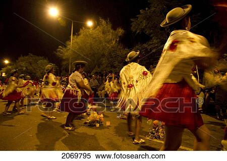 Women Dancing Around Festive Baskets In The Gran Entrada De Comadres Parade During The Carnaval Chapaco At Night, Tarija, Bolivia View Large Photo Image Stock Photography - Women Dancing Around Festive Baskets In The Gran Entrada De Comadres Parade During The Carnaval Chapaco At Night, Tarija, Bolivia. Fotosearch