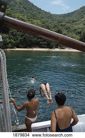 Women Diving Off Boat Into Sea View Large Photo Image Picture - Women Diving Off Boat Into Sea. Fotosearch