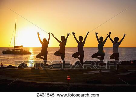 Women doing yoga at sunset; Barbados View Large Photo Image Stock Photography - Women doing yoga at sunset; Barbados. Fotosearch