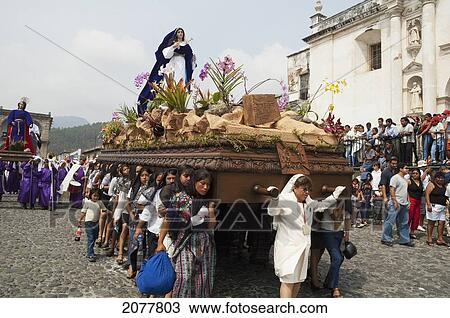 Women Dressed In Mourning Carry The Anda (Float) Of The Sorrowful Virgin Mary During A Good Friday Procession In Antigua Guatemala, Sacatep View Large Photo Image Stock Image - Women Dressed In Mourning Carry The Anda (Float) Of The Sorrowful Virgin Mary During A Good Friday Procession In Antigua Guatemala, Sacatep. Fotosearch