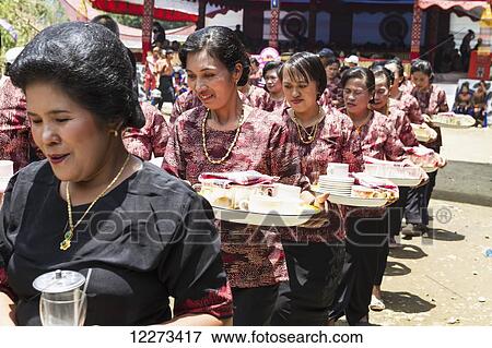 Women in a formal funeral procession called MaÆpassa Tedong at a rante, the ceremonial site for a Torajan funeral, in Sereale, Toraja Land, South Sulawesi, Indonesia View Large Photo Image Stock Photo - Women in a formal funeral procession called MaÆpassa Tedong at a rante, the ceremonial site for a Torajan funeral, in Sereale, Toraja Land, South Sulawesi, Indonesia. Fotosearch