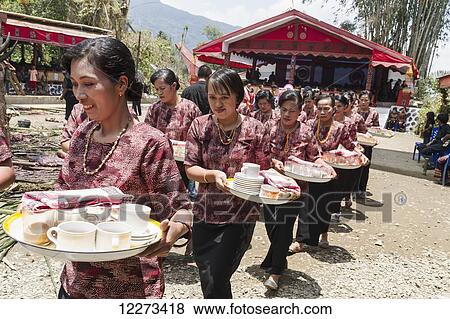 Women in a formal funeral procession called MaÆpassa Tedong at a rante, the ceremonial site for a Torajan funeral, in Sereale, Toraja Land, South Sulawesi, Indonesia View Large Photo Image Stock Photo - Women in a formal funeral procession called MaÆpassa Tedong at a rante, the ceremonial site for a Torajan funeral, in Sereale, Toraja Land, South Sulawesi, Indonesia. Fotosearch