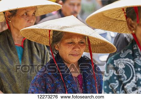 Women in a formal funeral procession called MaÆpassa Tedong at a rante, the ceremonial site for a Torajan funeral, in Sereale, Toraja Land, South Sulawesi, Indonesia View Large Photo Image Stock Photograph - Women in a formal funeral procession called MaÆpassa Tedong at a rante, the ceremonial site for a Torajan funeral, in Sereale, Toraja Land, South Sulawesi, Indonesia. Fotosearch