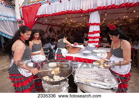 Women In Traditional Clothes Cooking Chocolat Con Churros During April Feria Festival; Seville, Andalucia, Spain View Large Photo Image Stock Photograph - Women In Traditional Clothes Cooking Chocolat Con Churros During April Feria Festival; Seville, Andalucia, Spain. Fotosearch