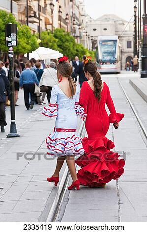 Women In Traditional Seville Dress During April Feria Festival; Seville, Andalucia, Spain, Europe View Large Photo Image Stock Photo - Women In Traditional Seville Dress During April Feria Festival; Seville, Andalucia, Spain, Europe. Fotosearch