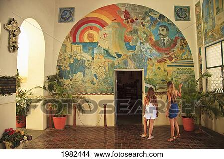 Women Looking At A Wall Mural In Downtown Area; Todos Santos Baja California Sur Mexico View Large Photo Image Picture - Women Looking At A Wall Mural In Downtown Area; Todos Santos Baja California Sur Mexico. Fotosearch