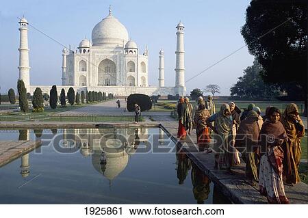 Stock Image - Women On Bank Of Canal By Taj Mahal. Fotosearch
