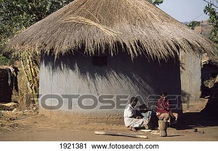 Stock Image - Women Outside Traditional Hut ÃƒÆ’Ã‚Â¡. Fotosearch