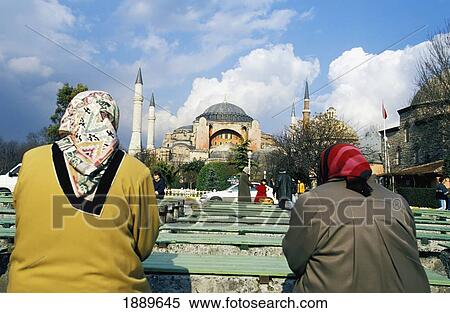 Women Sat On Bench By Mosque View Large Photo Image Stock Photography - Women Sat On Bench By Mosque. Fotosearch