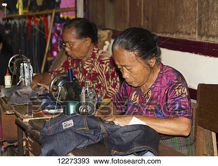 Women sewing at the Bolu market, Rantepao, Toraja Land, South Sulawesi, Indonesia View Large Photo Image Stock Image - Women sewing at the Bolu market, Rantepao, Toraja Land, South Sulawesi, Indonesia. Fotosearch