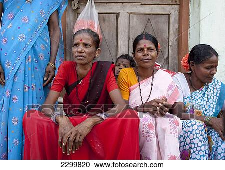 Stock Image - Women sit together, Chaudi Market, Chaudi, Goa, India.. Fotosearch