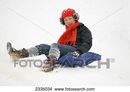 Picture - Women Using Plastic Sheet As Snow Sled; Greenwich Park, London, England, Uk. Fotosearch