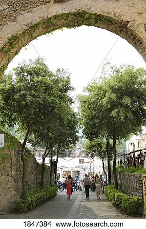 Picture - Women Walking Under Arch; Ravello, Italy. Fotosearch
