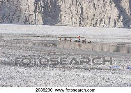 Women Washing Clothes In The Shyok River, Khaplu, Northern Areas, Pakistan View Large Photo Image Stock Image - Women Washing Clothes In The Shyok River, Khaplu, Northern Areas, Pakistan. Fotosearch