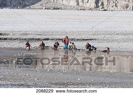 Women Washing Clothes In The Shyok River, Khaplu, Northern Areas, Pakistan View Large Photo Image Stock Photo - Women Washing Clothes In The Shyok River, Khaplu, Northern Areas, Pakistan. Fotosearch