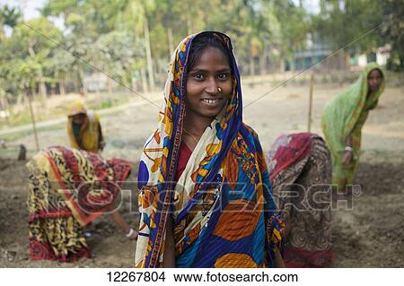 Picture - Women working on communal plot; Kishoreganj, Bangladesh. Fotosearch