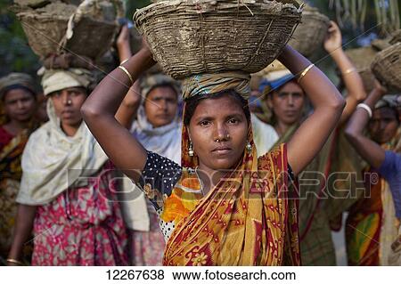 Women working on community project; Kishoreganj, Bangladesh View Large Photo Image Stock Photo - Women working on community project; Kishoreganj, Bangladesh. Fotosearch
