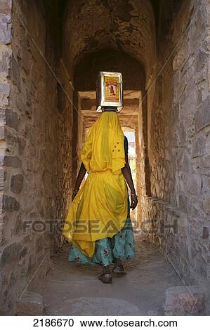 Stock Image - Women Working On The Restoration Of The Deserted City Of Bhangarh Alwar District Rajasthan India. Fotosearch