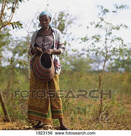 Stock Photograph - Womman Weaving Bags. Fotosearch