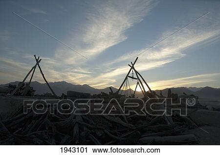Stock Image - Wood And Used Tire Vendor In Maidan Shar At Sunset, Vardak Province, Afghanistan. Fotosearch