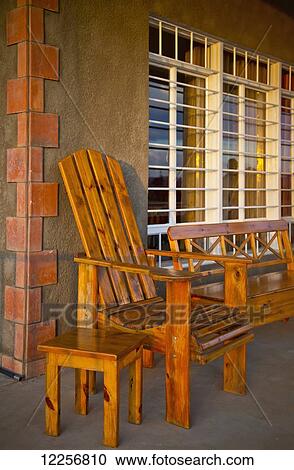 Wooden bench, chair and table on porch; Rwanda View Large Photo Image Stock Image - Wooden bench, chair and table on porch; Rwanda. Fotosearch