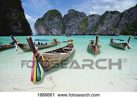 Stock Image - Wooden Boats In Maya Bay. Fotosearch