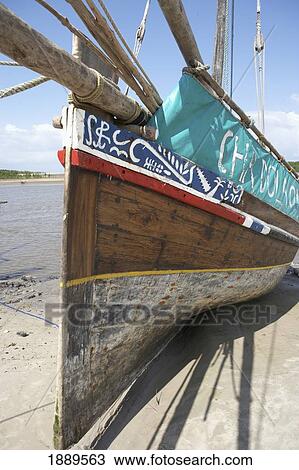 Stock Image - Wooden Dhow On Beach. Fotosearch