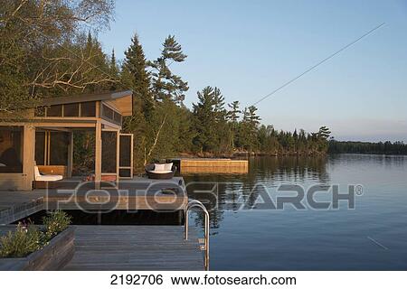 Stock Photograph - Wooden Docks On The Edge Of A Lake; Lake Of The Woods Ontario Canada. Fotosearch