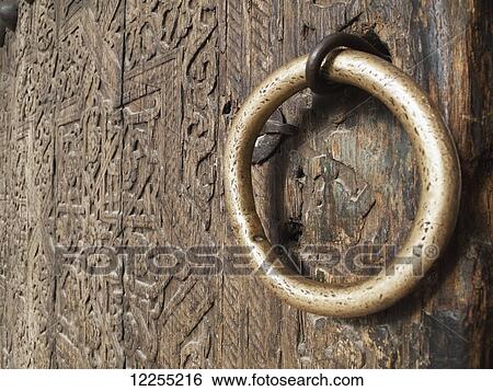 Stock Photograph - Wooden door of Mohammed Rakhim Khan Madrassah, Ichan Kala Old City, Kizilkum desert; Khiva, Khwarezm region, Uzbekistan. Fotosearch